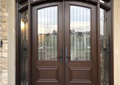 Arched fiberglass front entry door